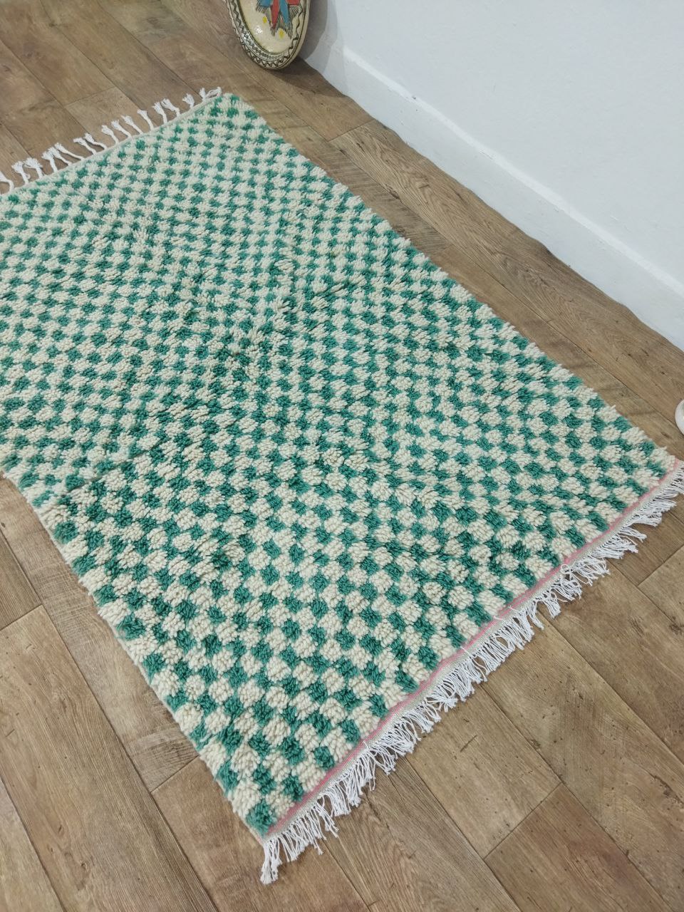 Elevate your space with our stunning Green and white checkered rug from Morocco. Handmade by Berber artisans, available in various sizes. Add luxury and sophistication to your home decor.
